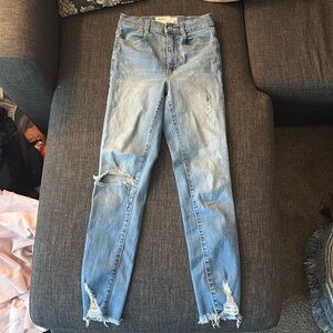 Size 0 ripped garage skinny jeans